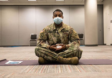 Service Member engaging in mindfulness meditation for optimized performance and mental health   U S  Army photo by Pfc  Genes