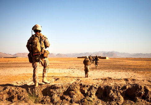 U S  Marines walking in the desert after studying HPRC heat illness and injury prevention resources for improved physical fit