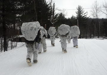 Marines march in the snow during military training and use HPRC performance optimization resources to improve military fitnes