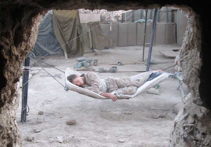 A Marine squad leader sleeps in between patrols  Photo by II Marine Expeditionary Force