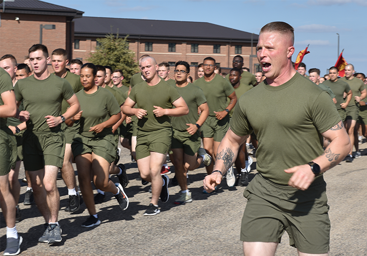 U S  Marine Staff Sgt  Isaac Ross  Marine Corps Detachment Goodfellow instructor  calls cadence during a motivational run 