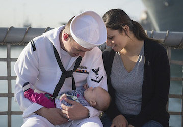 Seaman and his wife practice military wellness and relationship communication by holding their baby daughter   U S  Navy phot